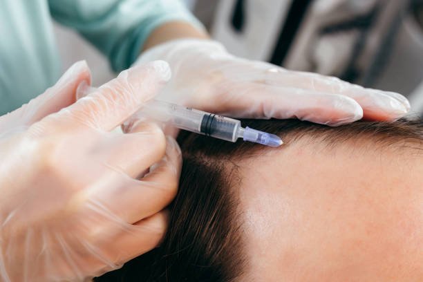 young man receiving injection, close up