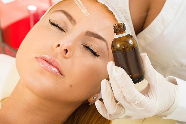 a beautiful woman receiving a facial treatment